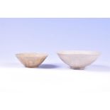 Two antique glazed Chinese ceramic bowls the largest 16 cm in diameter with a fluted interior, the