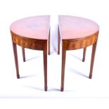 A pair of Heals walnut demilune tables originally part of a dining table, with segmented veneered