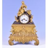A 19th century French ormolu figural mantel clock the white porcelain dial with blue Roman numerals,