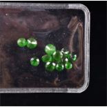 A small quantity loose green garnets approximately 4.90 carats combined. (13)