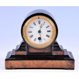 A small Victorian ebonised and burr veneered mantel clock of drum shaped form, the white enamel dial