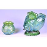 An Austrian Loetz style iridescent green glass conch shell vase with applied iridescent blue line