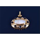 A yellow metal, diamond, sapphire, and opal pendant of oval form, set with an oval-shaped opal,