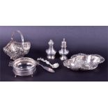 A small group of assorted silver including a silver dish, an .800 silver basket, two pepperettes,