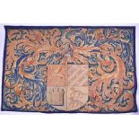 A large 19th century French tapestry wall hanging with central armorial cartouche, 146 cm x 204 cm.