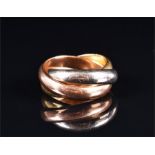 A Russian-style trilogy ring the bands of rose, white, and yellow metal, stamped '1140 MI', size