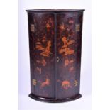 An 18th century painted pine chinoiserie corner cabinet of bow fronted form, the doors painted