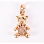 Chopard. An 18ct yellow gold 'happy diamond' teddy bear pendant the teddy's tummy with a floating
