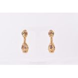 An impressive pair of 18ct yellow gold and pearl drop earrings the articulated openwork mounts set