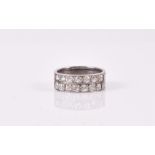 A white metal and diamond half eternity ring set fourteen old round-cut diamonds of approximately