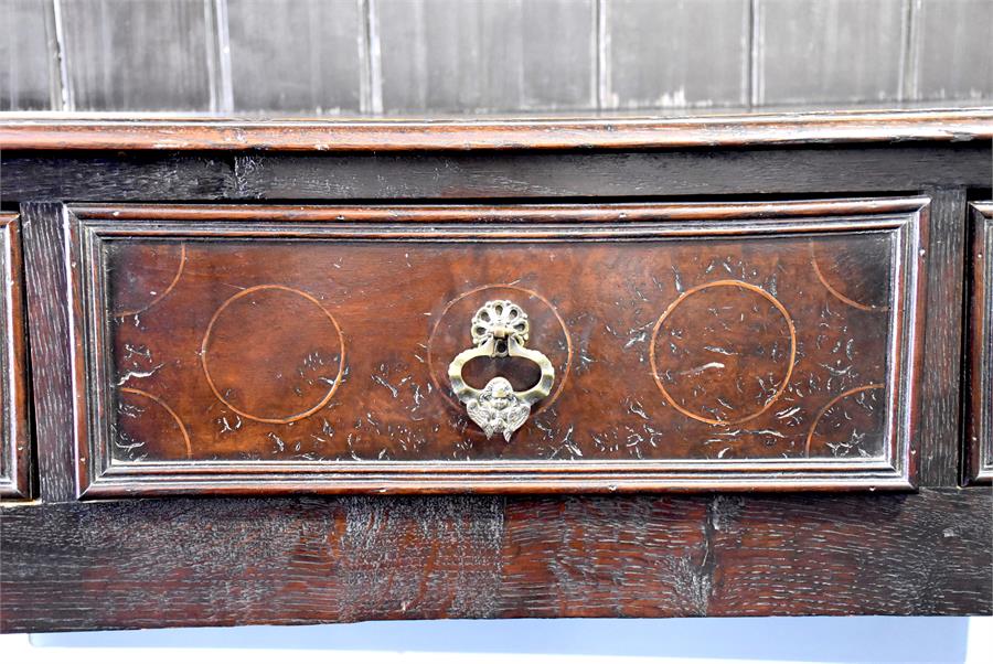 A late 18th / early 19th century oak dresser the top with shaped frieze over three shelves with - Image 2 of 3