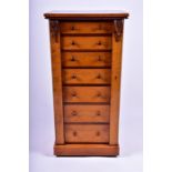 A Victorian birds-eye maple Wellington chest the figured top over bank of seven graduated drawers