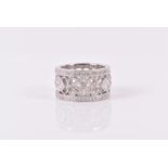 An 18ct white gold and diamond eternity ring the openwork mount set calibre-set with princess-cut