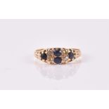 An 18ct yellow gold, diamond, and sapphire ring size P, 3.5 grams.