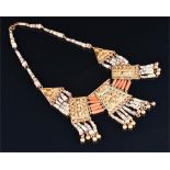An unusual coral and hardstone beaded bib necklace with five silver gilt embossed panels.