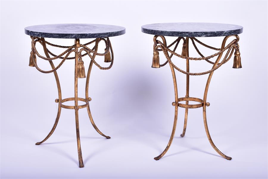 A pair of French marble top gilt side tables the circular veined marble top mounted below with