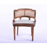 A small 19th century French bergere and carved gilt wood chair the curved back with a woven panel