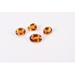 Four loose orange citrines of oval and pear-cut faceted form. (4) Note: VAT is payable on the hammer