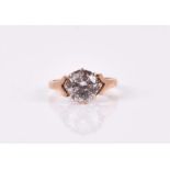 A 9ct yellow gold and cubic zirconia solitaire ring set with a round-cut CZ, approximately 8 mm