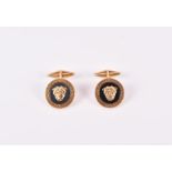 A pair of Versace 18ct yellow gold cufflinks formed as the head of Medusa on a hardstone ground with