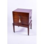 A William IV mahogany cellarette of plain form with visible dovetail joints, brass escutcheon,