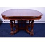 A large 19th century French walnut extending dining table  with three removable leaves, the walnut
