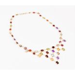 A fine-link yellow metal and multi-gem necklace set with oval gemstones including garnet, peridot,