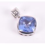 An 18ct white gold, diamond and sapphire pendant set with a 6.32 carat natural blue sapphire,