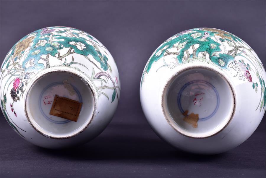 A pair of 19th century Chinese porcelain vases the ovoid shaped bodies decorated with enamelled - Image 11 of 21