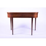 An Edwardian mahogany veneered folding tea table on tapering supports with satinwood inlaid borders,