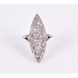 A navette-shaped diamond ring the elongated mount set with old round-cut diamonds of approximately