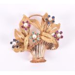 An 18ct yellow gold and gemstone jardiniere brooch in the form of a floral basket, the flowers