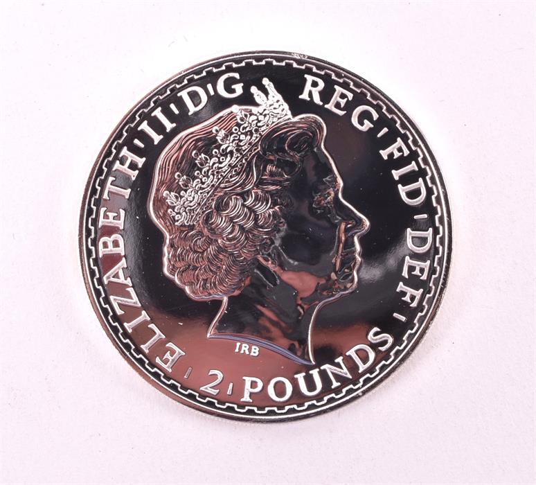 MIXED COINS, GREAT BRITAIN. A mint tube of twenty Fine Silver Britannias, 2014 Contained in the