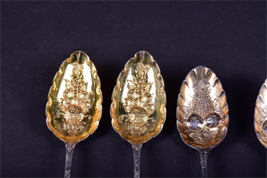 A collection of 18th century and later silver fruit spoons comprising one trio and two pairs, - Image 3 of 9