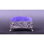 An Edwardian pierced silver jewellery box Chester 1903, with scrolled foliate decoration, and purple