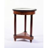 A  Regency style tripod side table with veined white marble top within a brass rim, above three