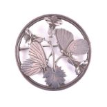 George Jensen. A silver butterfly brooch of circular form, depicting two butterflies on leaves,