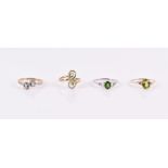 Four 9ct yellow gold rings to include a peridot ring, a chrome diopside ring, a green apatite