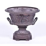 A reproduction bronze pedestal planter in the Classical style the oval shaped bowl with egg and dart