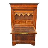 A 19th century French marble top walnut secretaire opening to reveal a fitted interior with