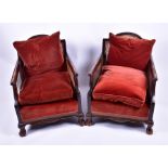 A pair of 1920s mahogany Bergere armchairs with caned backs and sides, loose-fitted cushions,