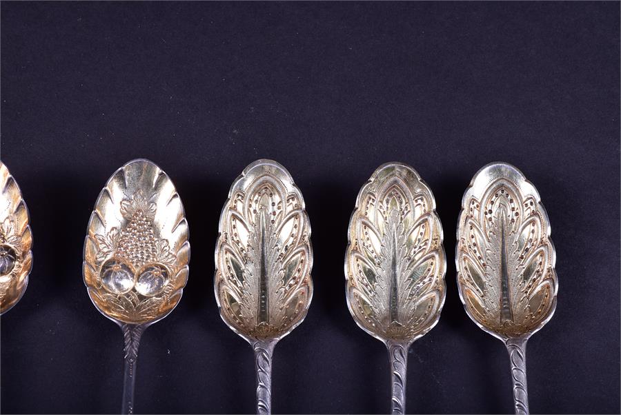 A collection of 18th century and later silver fruit spoons comprising one trio and two pairs, - Image 4 of 9