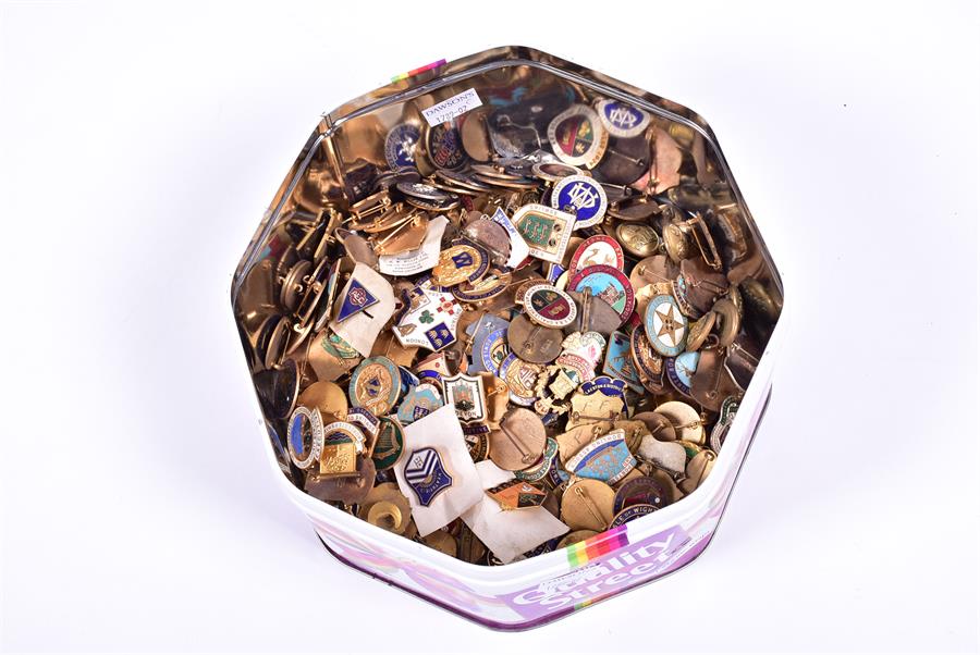 A large collection of brass and enamel pin badges  to include many bowling club examples.
