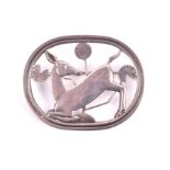 George Jensen. A sterling silver brooch decorated with a deer and foliate in an oval border, 4.4