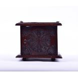 A 17th century Dutch carved oak brazier intricately carved with circular geometrical rosace