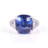An impressive 18ct white gold, diamond, and sapphire ring set with a cushion-cut sapphire of