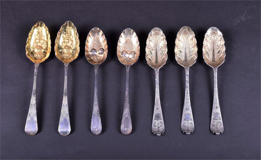 A collection of 18th century and later silver fruit spoons comprising one trio and two pairs,