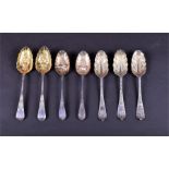 A collection of 18th century and later silver fruit spoons comprising one trio and two pairs,