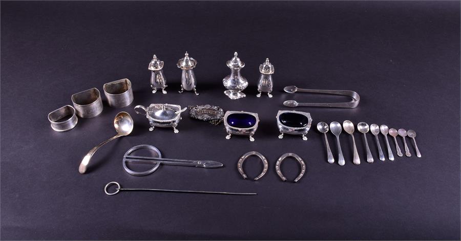 A mixed group of Victorian and later silver cruets comprising a pair of open salts, a covered