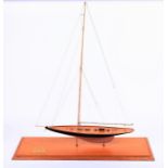 A large hand-made model of the yacht 'Britannia' complete with rigging, with furled sail, and